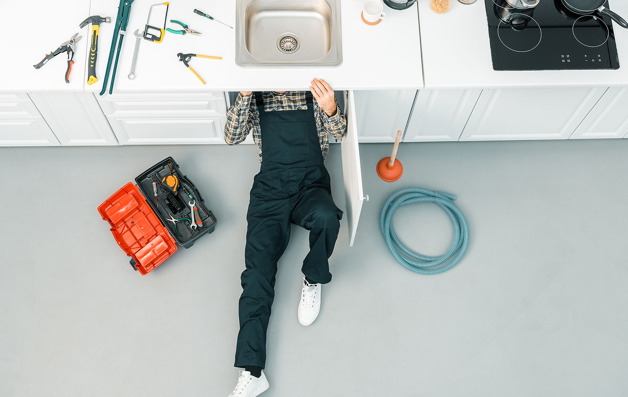 Handyman fixing a sink