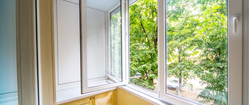 trees visible through open window