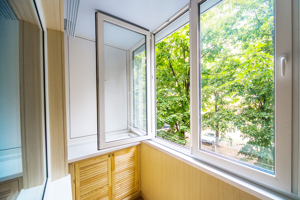 trees visible through open window
